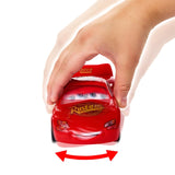 Red toy car with a hand pushing it, on a white background