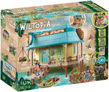 Playmobil Wiltopia toy set packaging with a wooden cabin and dock.