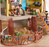 Toy playset with animals and people in a room
